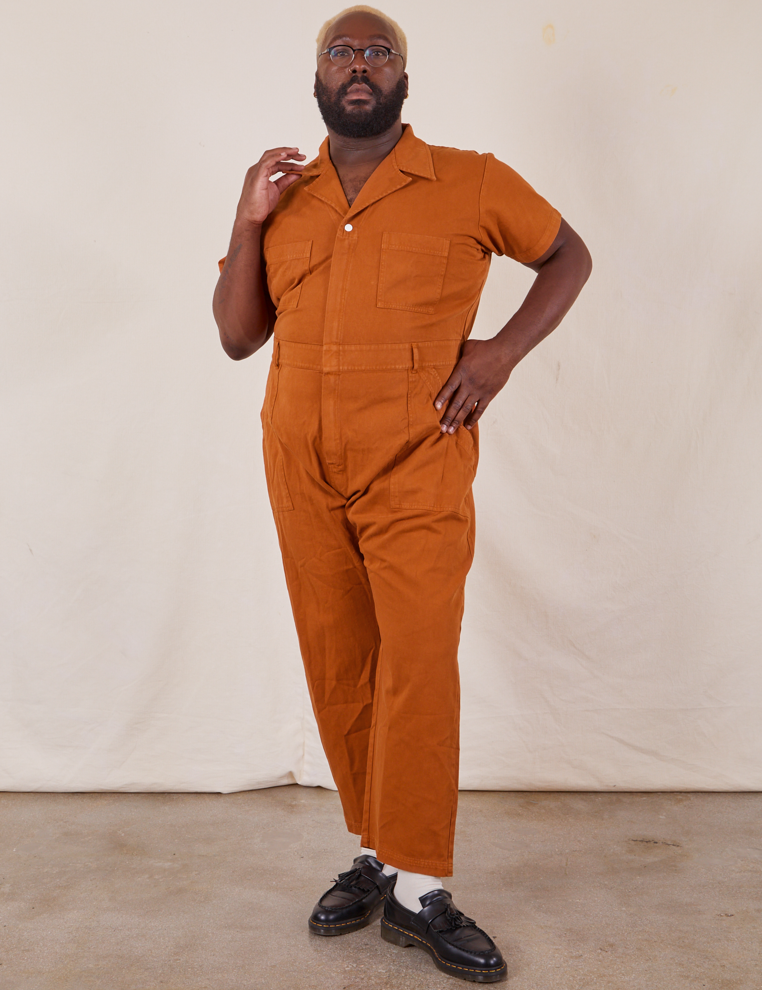 Elijah is 6’4” and wearing 4XL Short Sleeve Jumpsuit in Burnt Terracotta 