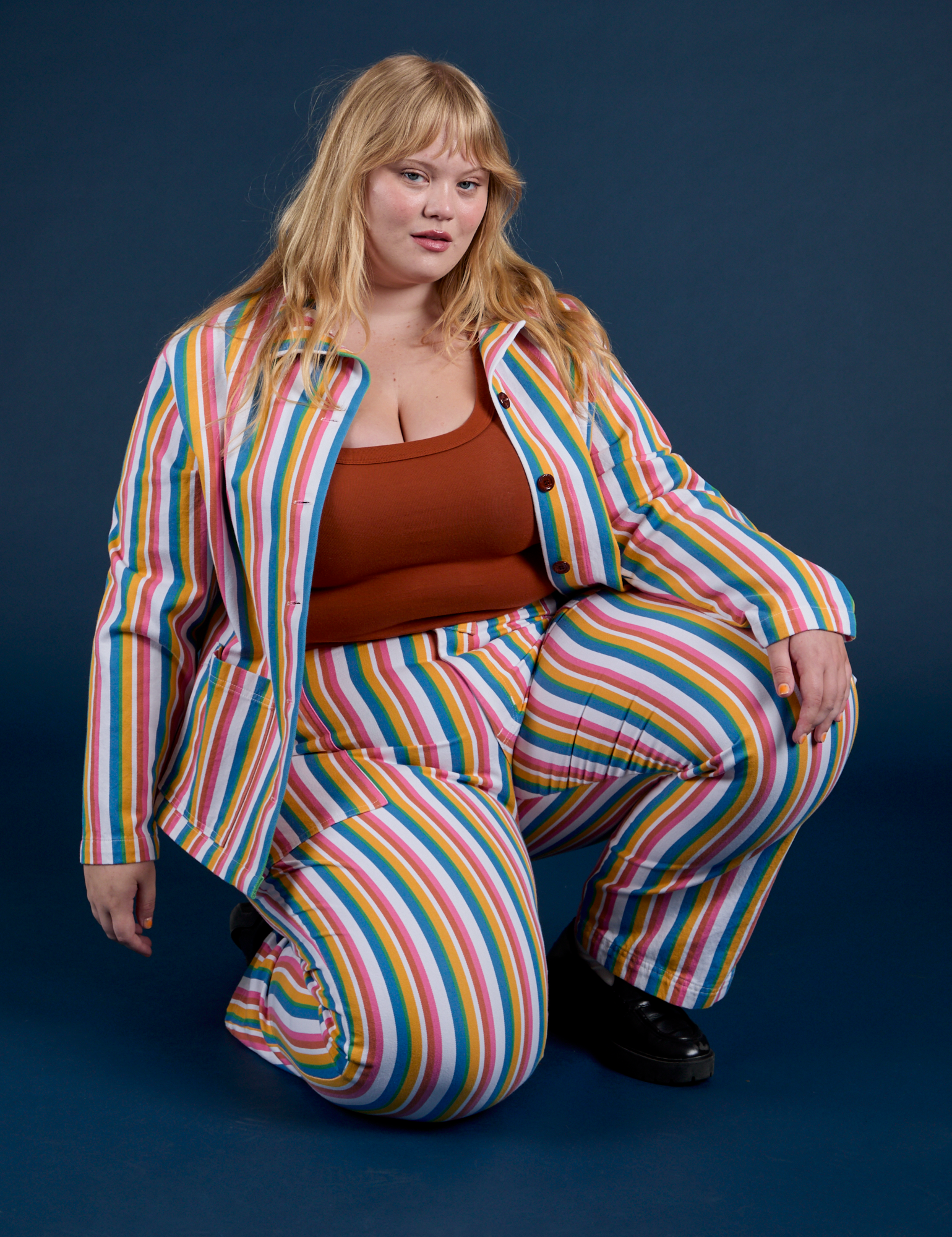 Juliet is wearing Stripe Work Jacket in Rainbow Stripe paired with matching Work Pants