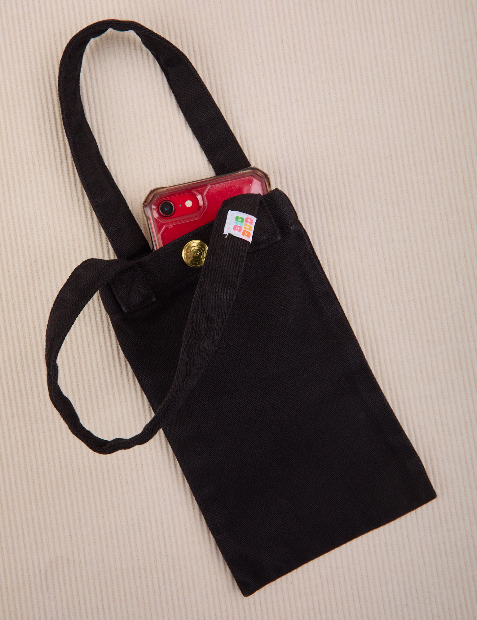 Phone tucked into black Cell Phone Tote