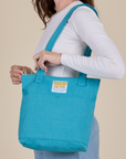 Over-Shoulder Zip Mini Tote in Hawaiian Blue worn on shoulder of model