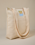 Angled view of Over-Shoulder Zip Mini Tote in Vintage Tee Off-White