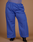 Close up of the Cornflower Blue Action Pant on Kristen