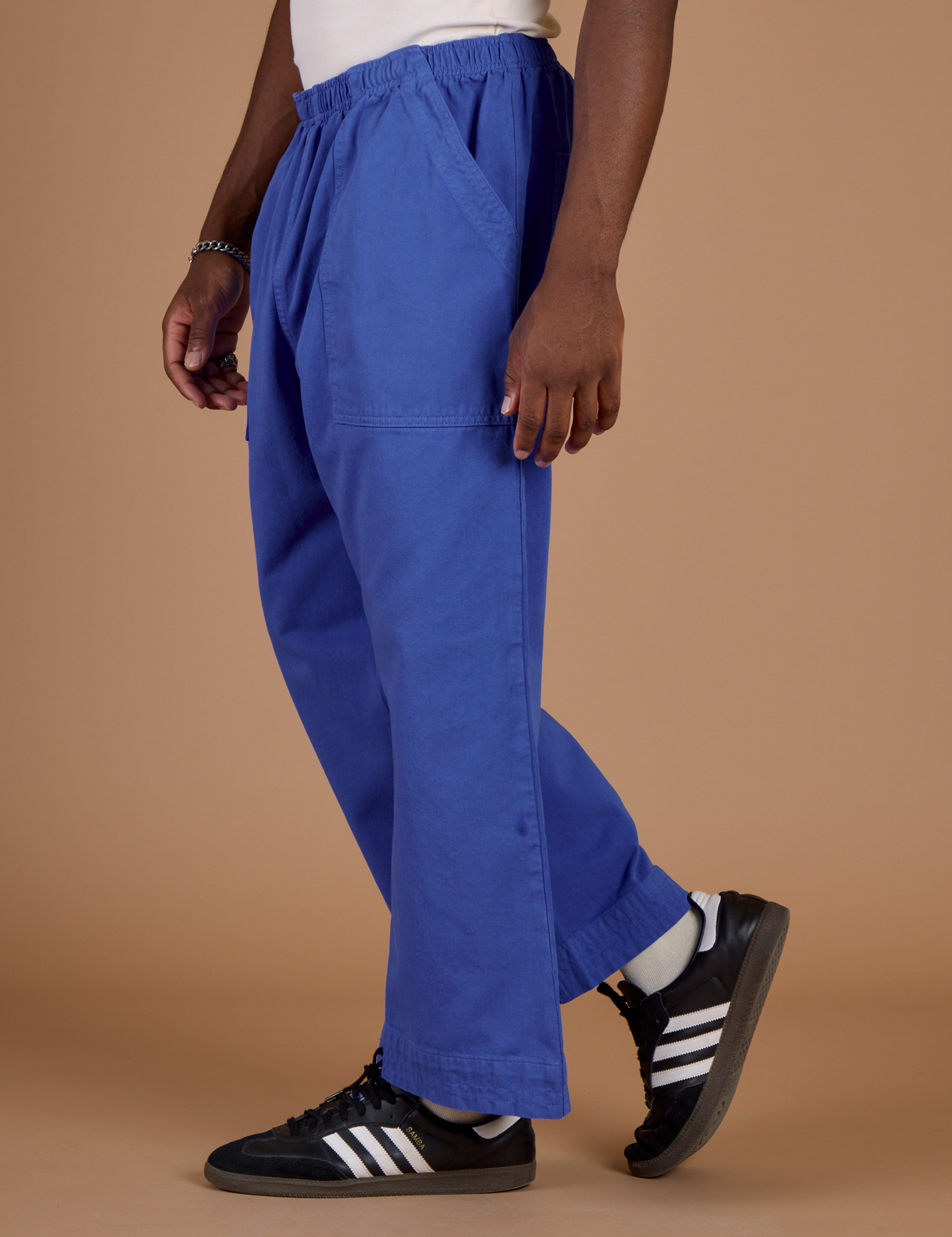 Close up side view of the Cornflower Blue Action Pant on Isaac