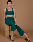 Alex wearing the Hunter Green Action Pant with the Hunter Green Mini Tank