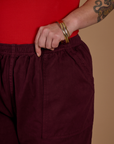 Close up of the waistband on the Red Wine Action Pant worn by Kristen