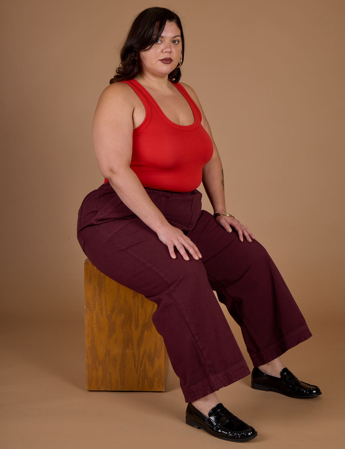 Kristen wearing the Red Wine Action Pant with the Mustang Tank Top