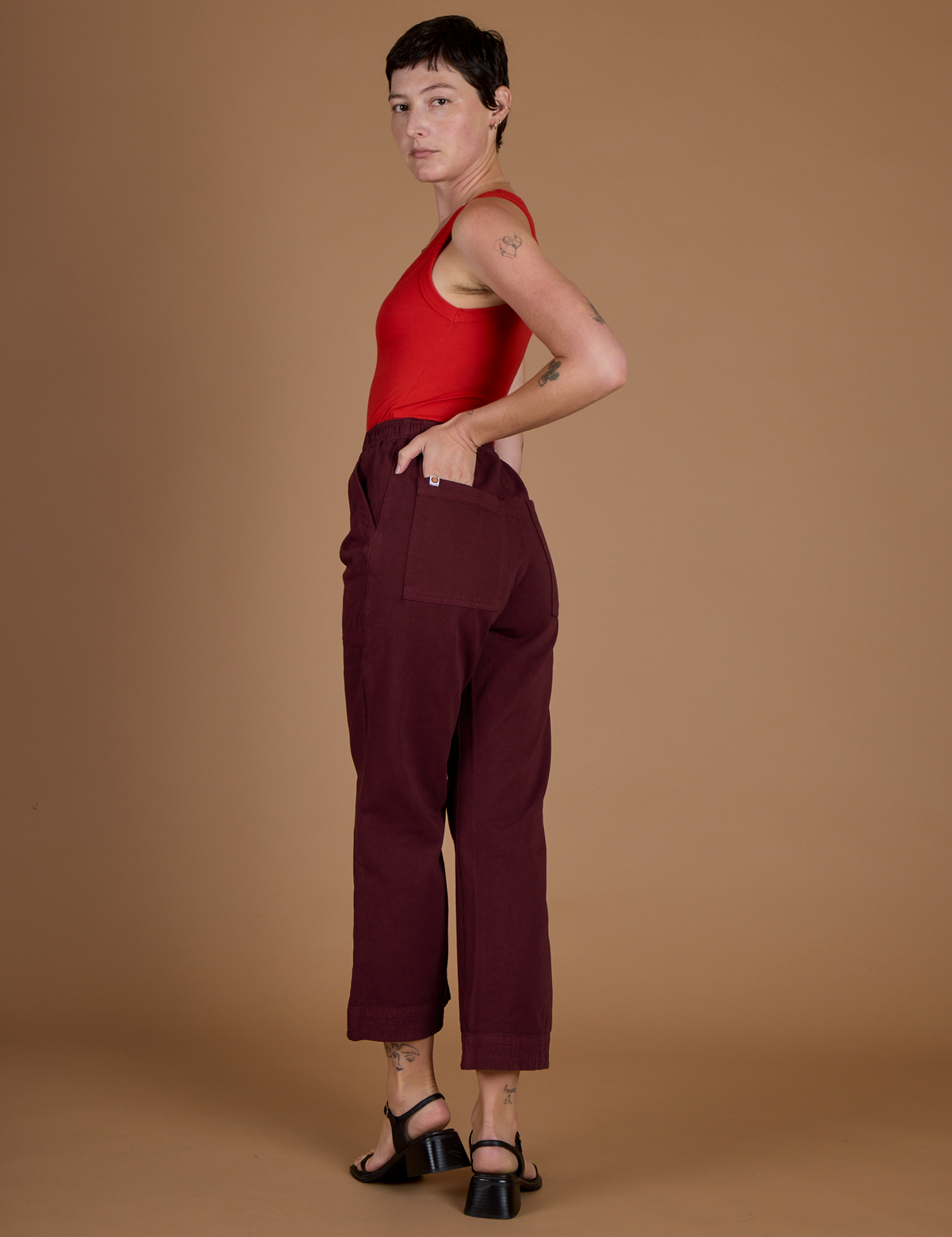 Angled back view of the Red Wine Action Pant