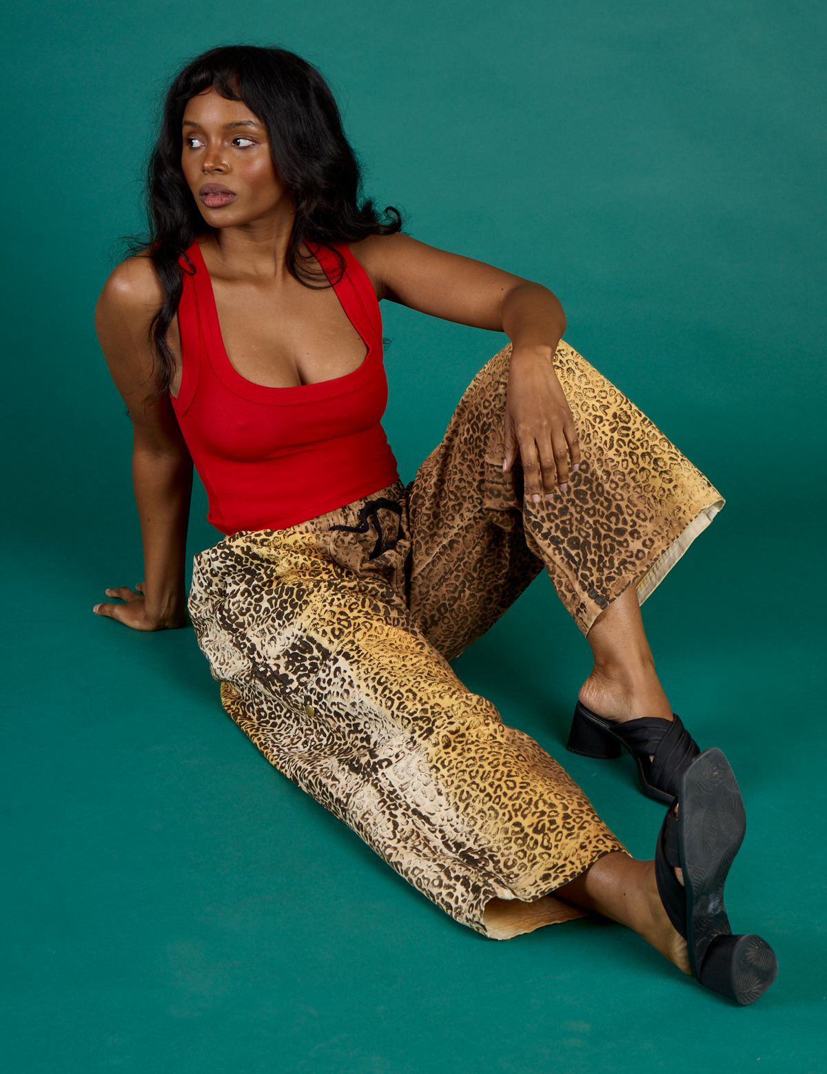 Kanida wearing the Leopard Drop Pocket Pant with the Mustang Red Cropped Tank