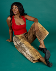 Kanida wearing the Leopard Drop Pocket Pant with the Mustang Red Cropped Tank