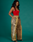 Angled side view of Kandia wearing the Leopard Drop Pocket Pant