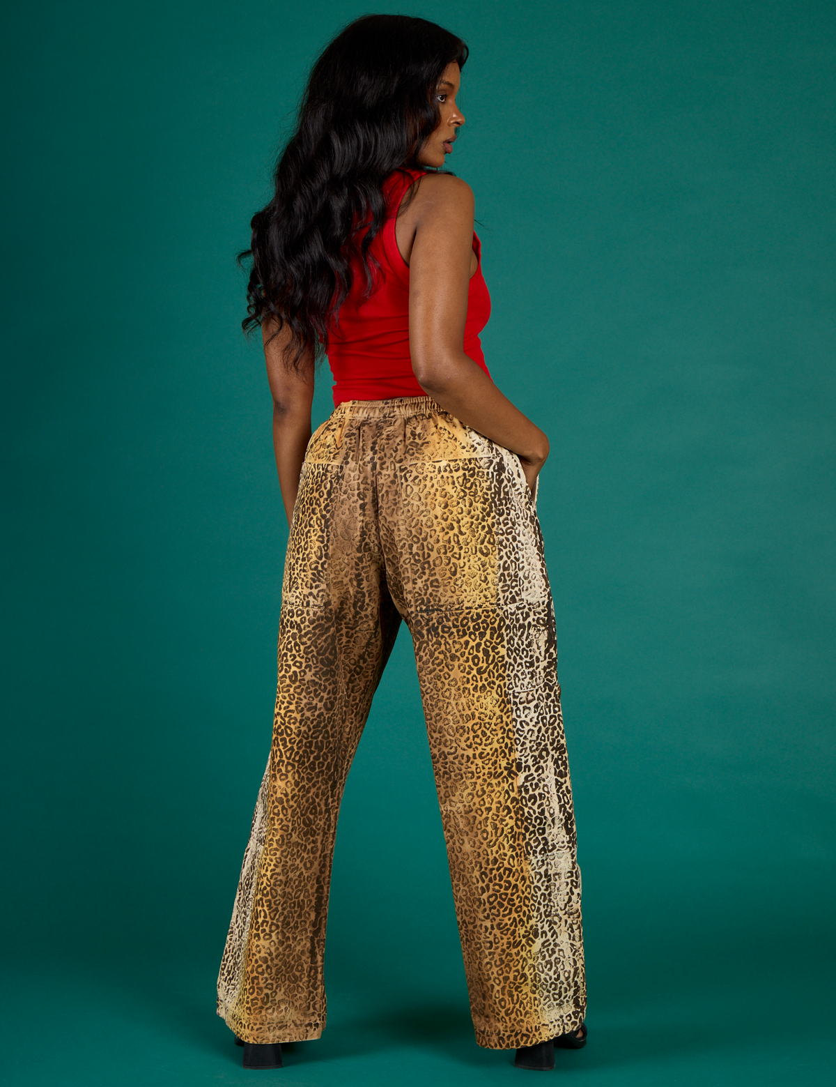 Angled side view of the Leopard Drop Pocket Pant on Kandia