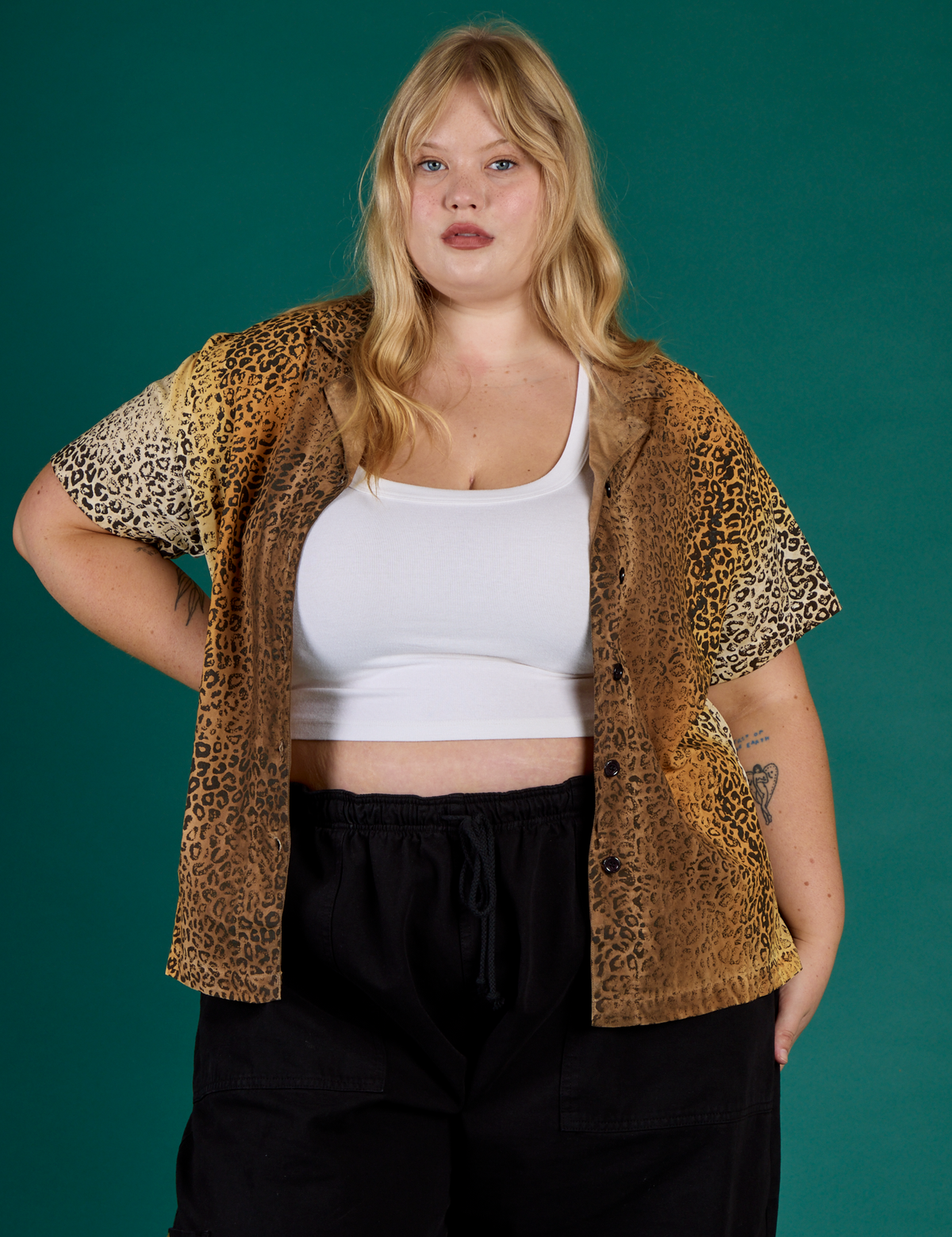Juliet is wearing the Leopard Pantry Button Up open with the Vintage Tee White Cropped Tank underneath