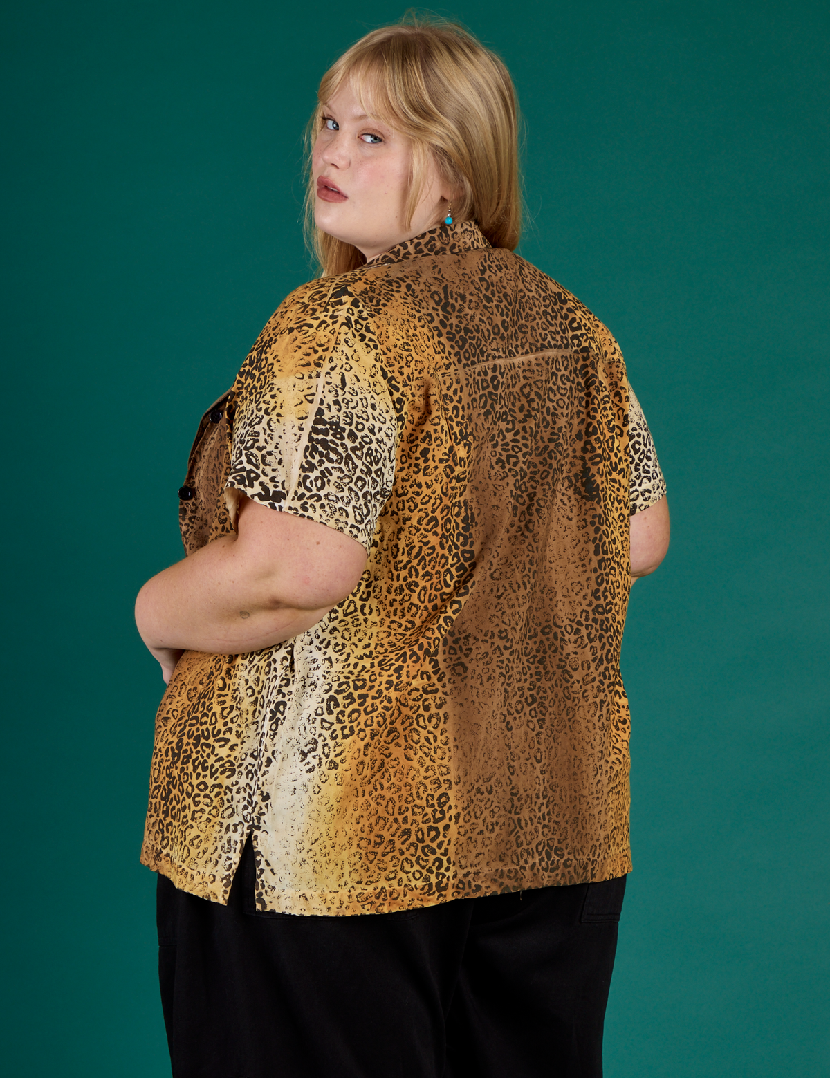 Angled back view of the Leopard Pantry Button Up on Juliet