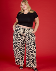 Juliet is 5'7" and wearing 2XL Cow Drop Pocket Pant with the Black Cropped Baby Tee