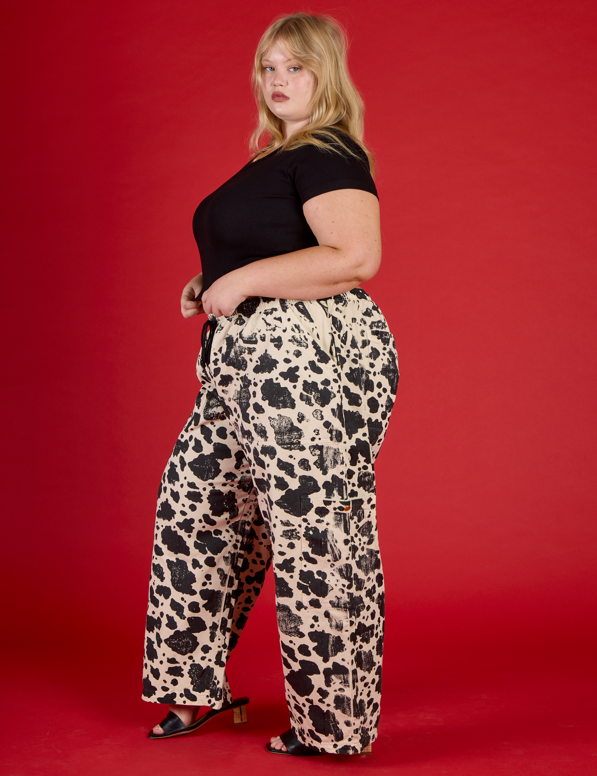 Side view of the Cow Drop Pocket Pant with the Black Cropped Baby Tee on Juliet