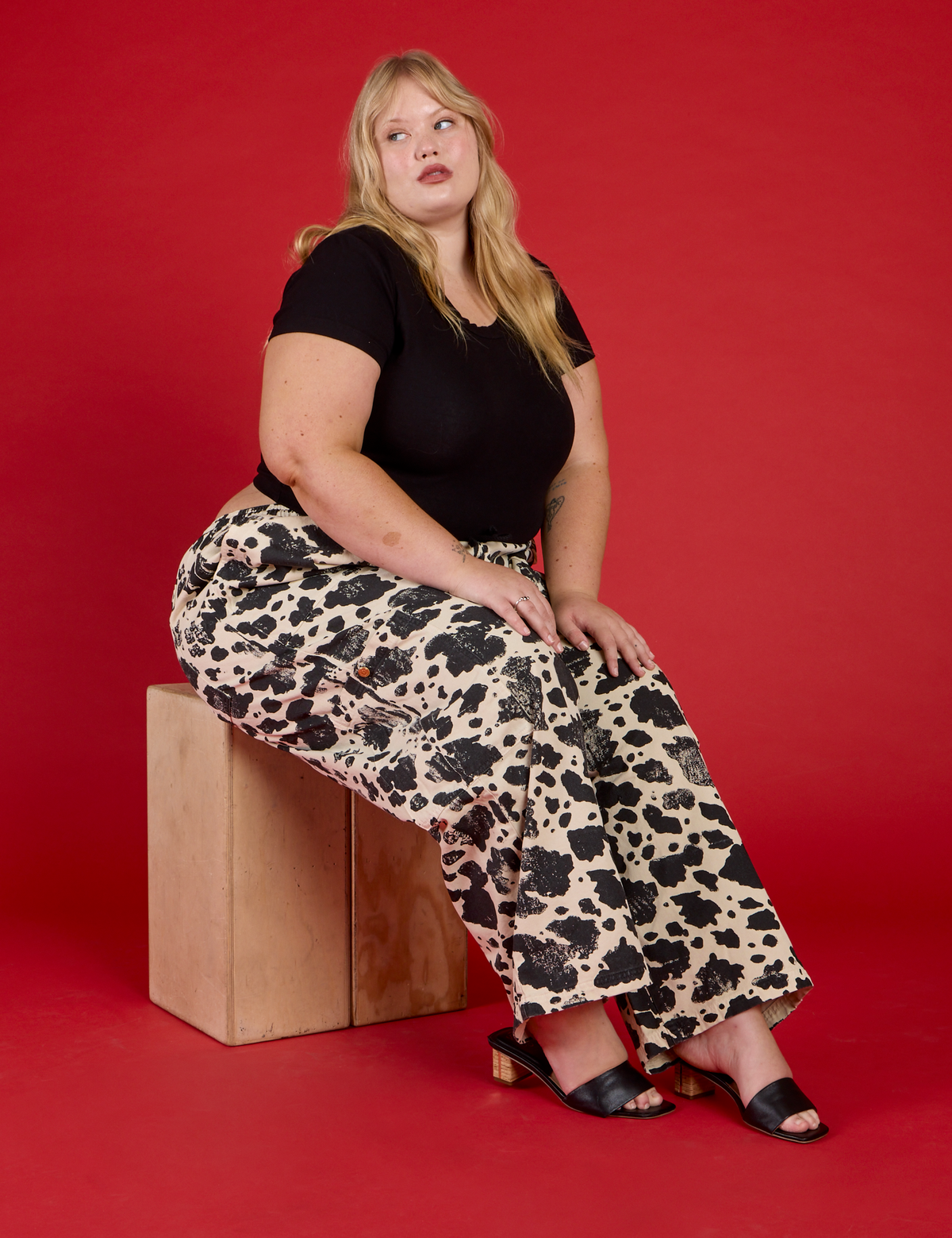 Juliet wearing the Cow Drop Pocket Pant with the Black Cropped Baby Tee
