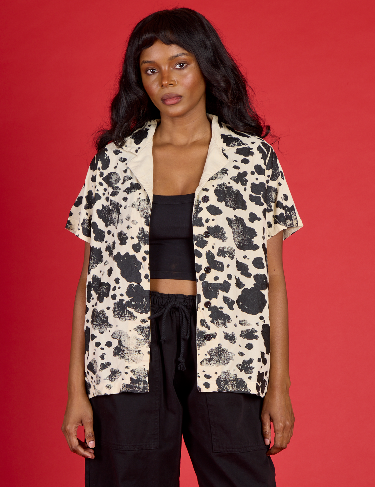 Kandia is wearing the Cow Pantry Button Up