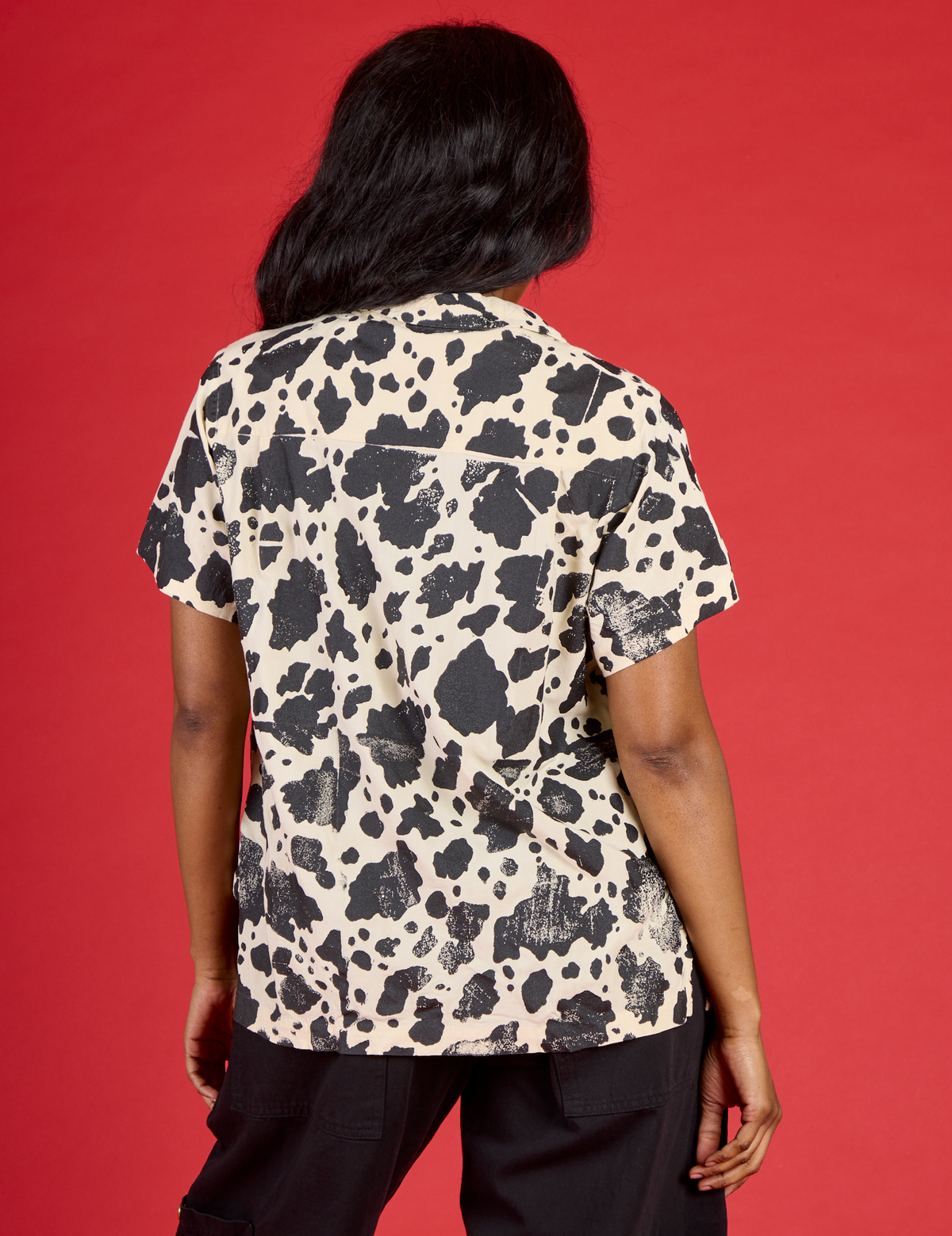 Back view of Kandia wearing the Cow Pantry Button Up