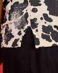 Close up of the side vent of the Cow Pantry Button Up worn by Kira