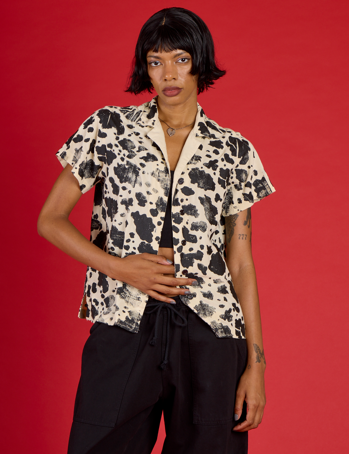 Kira wearing the Cow Pantry Button Up