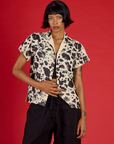 Kira wearing the Cow Pantry Button Up