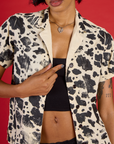 Close up of the Cow Pantry Button Up open with the Black Cropped Tank underneath