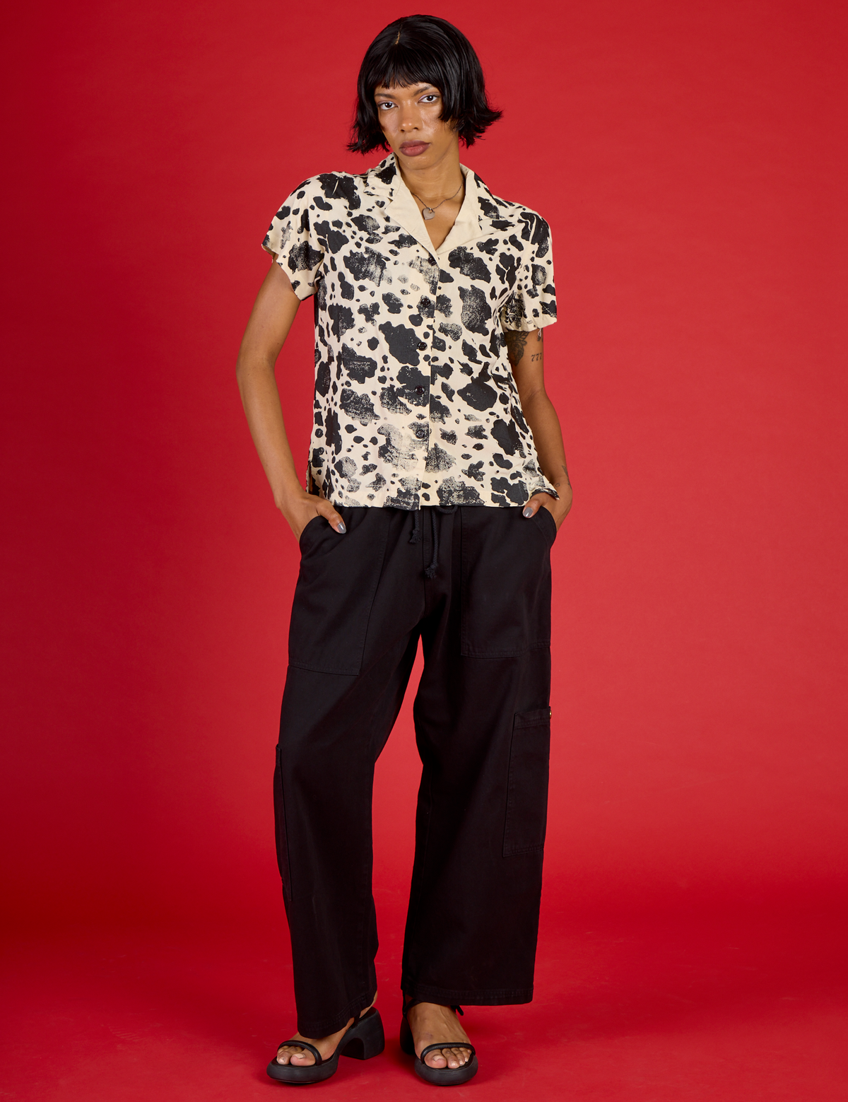 Kira wearing the Cow Pantry Button Up with the Black Drop Pocket Pants