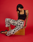 Kira wearing the Cow Work Pant with the Black Cropped Tank