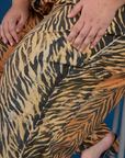Close up of the side leg pocket of the Tiger Drop Pocket Pant on Juliet