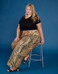 Juliet is wearing the Tiger Drop Pocket Pant with the Black Cropped Baby Tee
