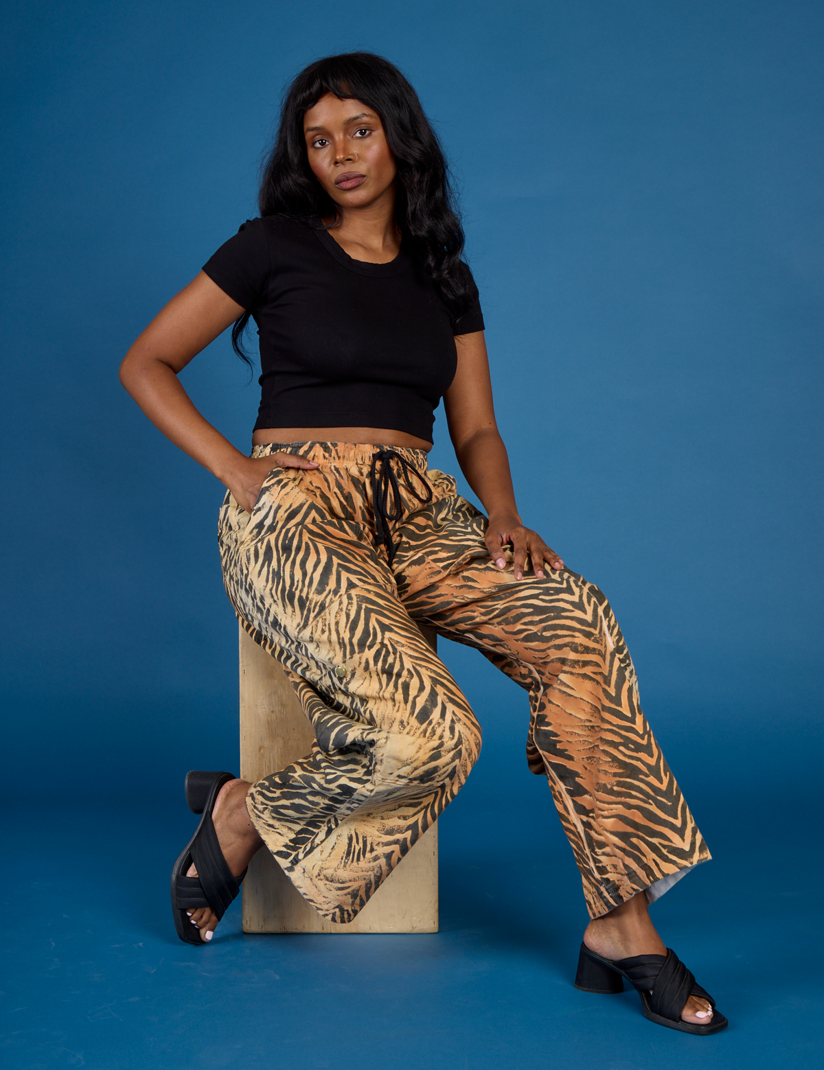 Kandia is wearing the Tiger Drop Pocket Pant with the Black Cropped Baby Tee