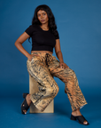 Kandia is wearing the Tiger Drop Pocket Pant with the Black Cropped Baby Tee