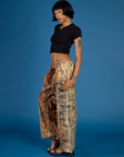 Angled side view of the Tiger Drop Pocket Pant on Kira