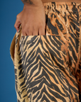 Close up of Kira's hand in the back pocket of the Tiger Drop Pocket Pant
