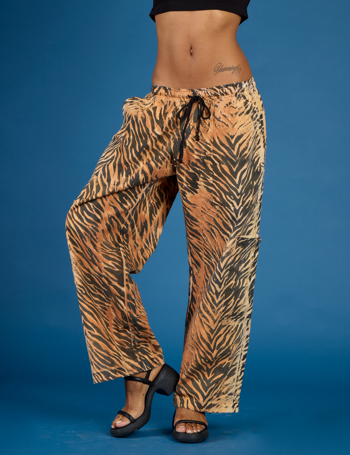 Close up of the Tiger Drop Pocket Pant on Kira