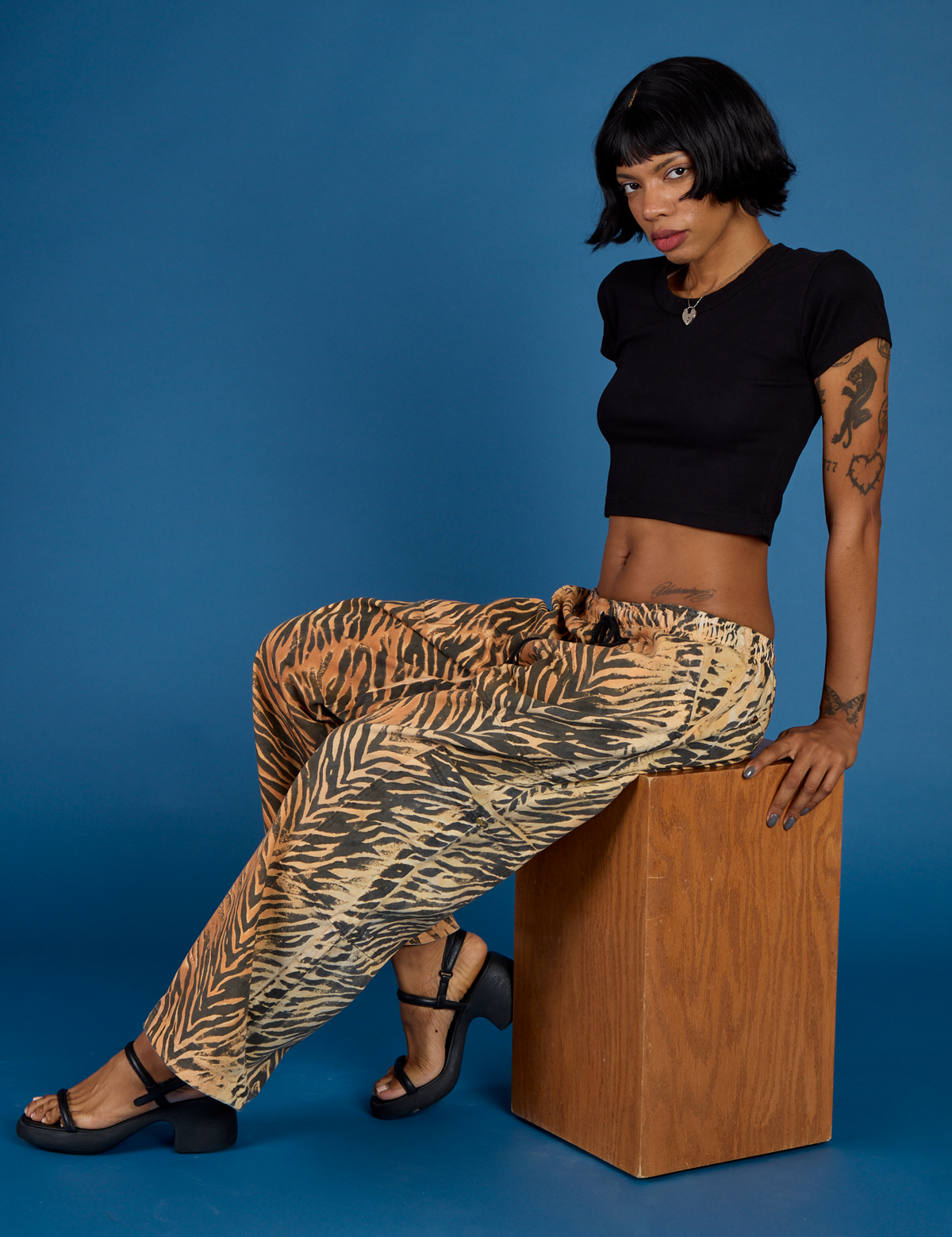 Kira wearing the Tiger Drop Pocket Pant with the Black Cropped Baby Tee