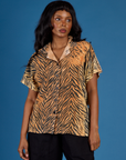 Kandia wearing the Tiger Pantry Button Up