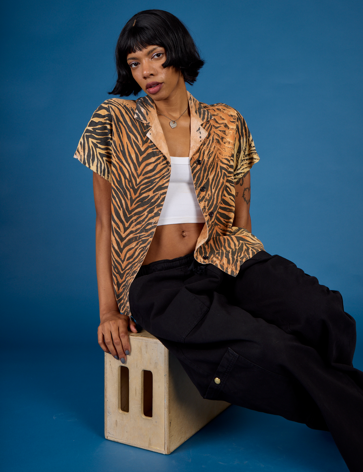 Kira wearing the Tiger Pantry Button Up with the Black Drop Pocket Pant