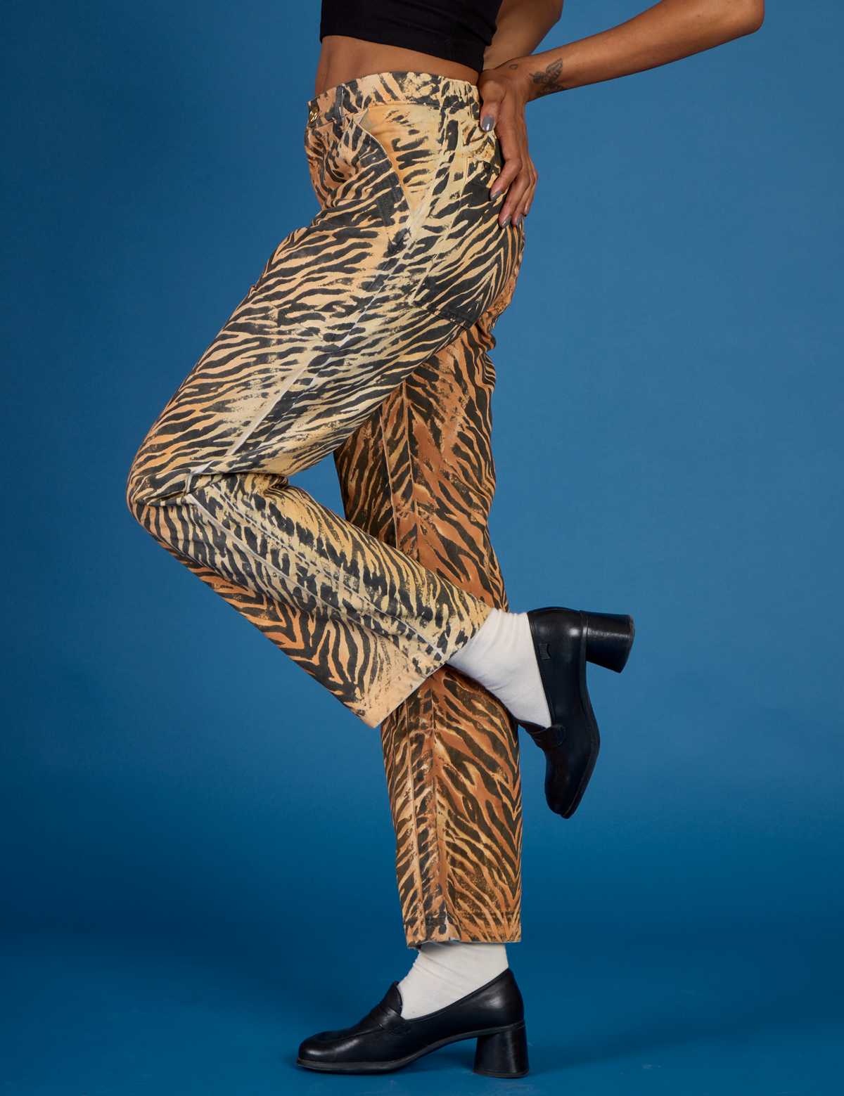 Close up side view of the Tiger Work Pant on Kira