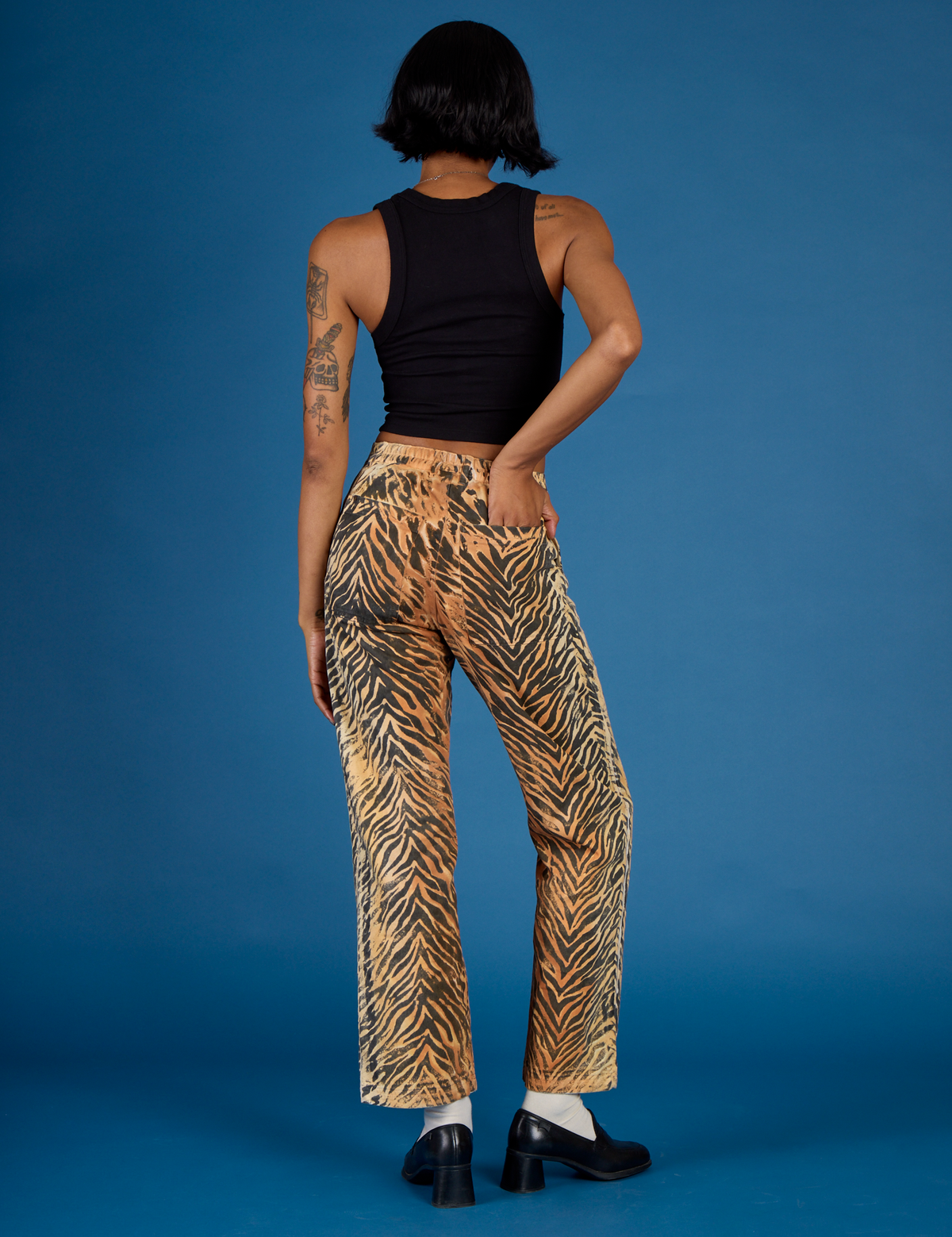 Back view of Kira wearing the Tiger Work Pant