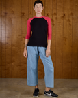 Alex is 5'8" and wearing P Black/Pink Colorblock Raglan Tee with Light wash Denim Drop Pocket Pants