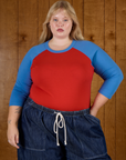 Juliet wearing the Mustang Red/Blue Colorblock Raglan Tee