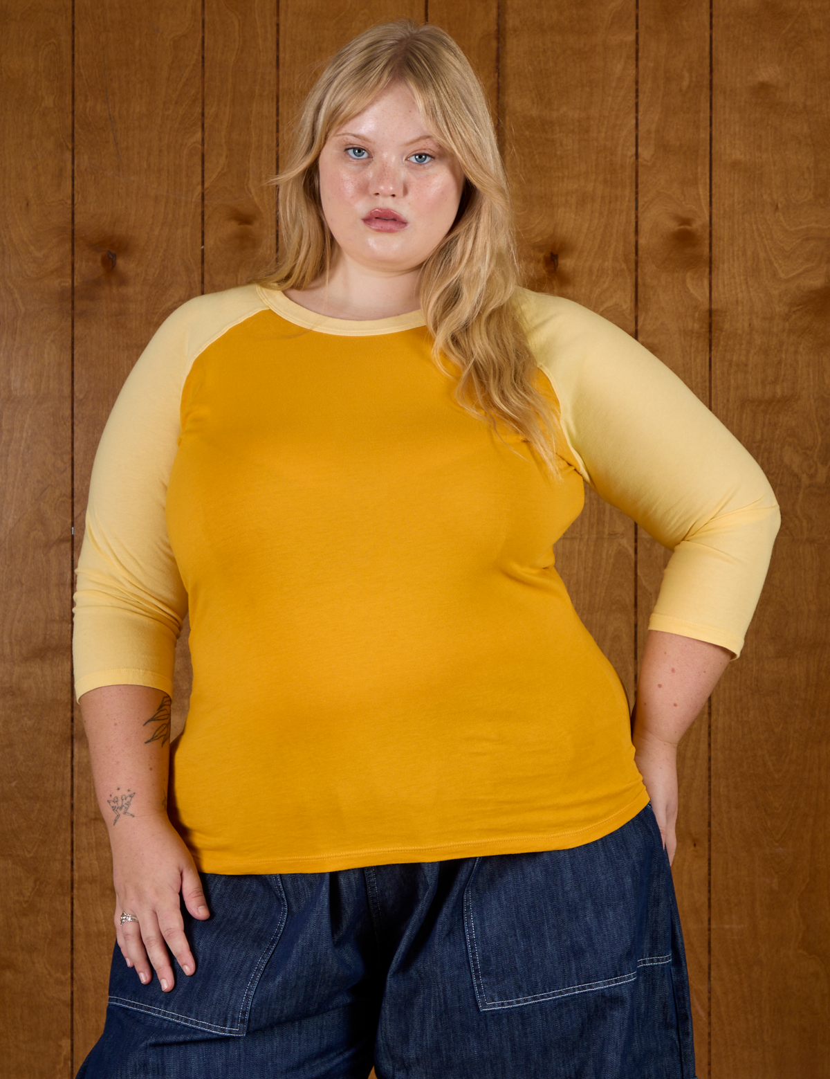 Juliet wearing the Mustard Yellow/Butter Raglan Tee