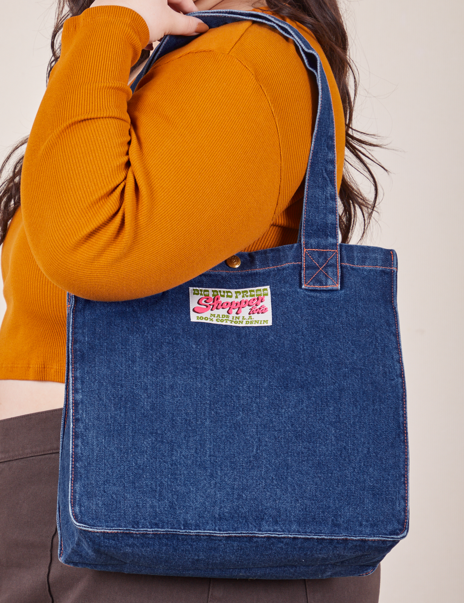 Denim Shopper Tote Bag in Dark Wash worn over model's shoulder