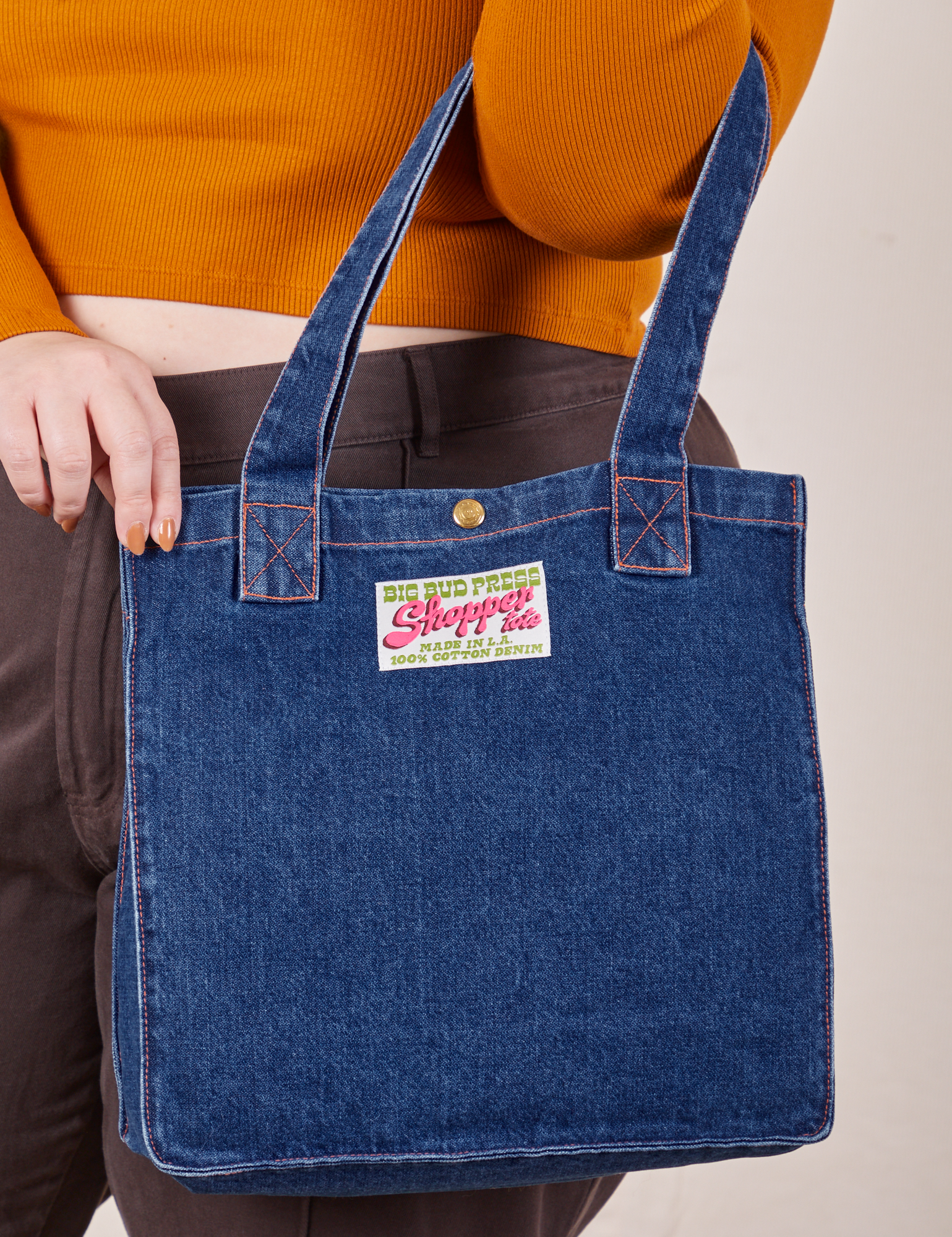 Denim Shopper Tote Bag in Dark Wash on arm of model