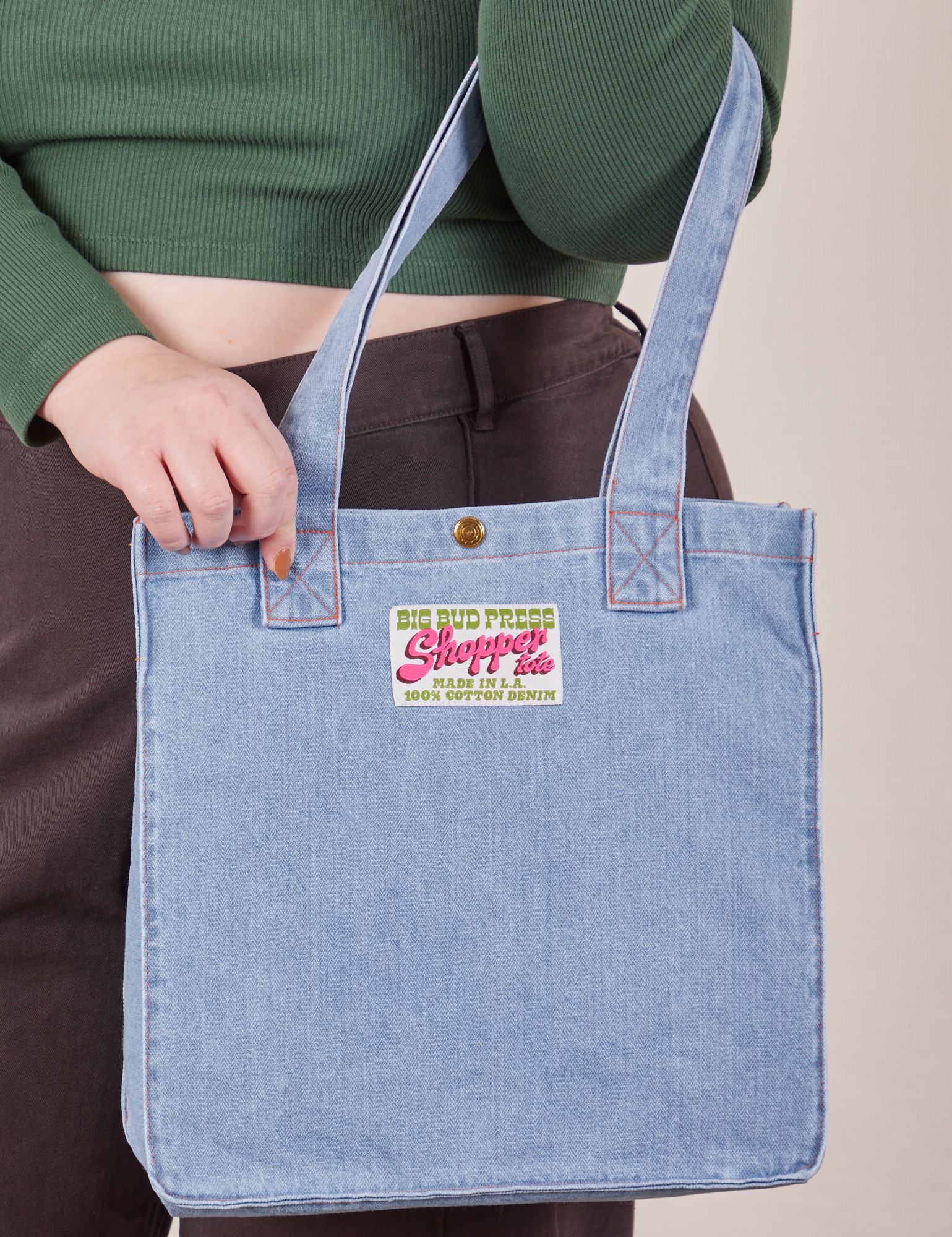 Denim Shopper Tote Bag in Light Wash worn on arm of model