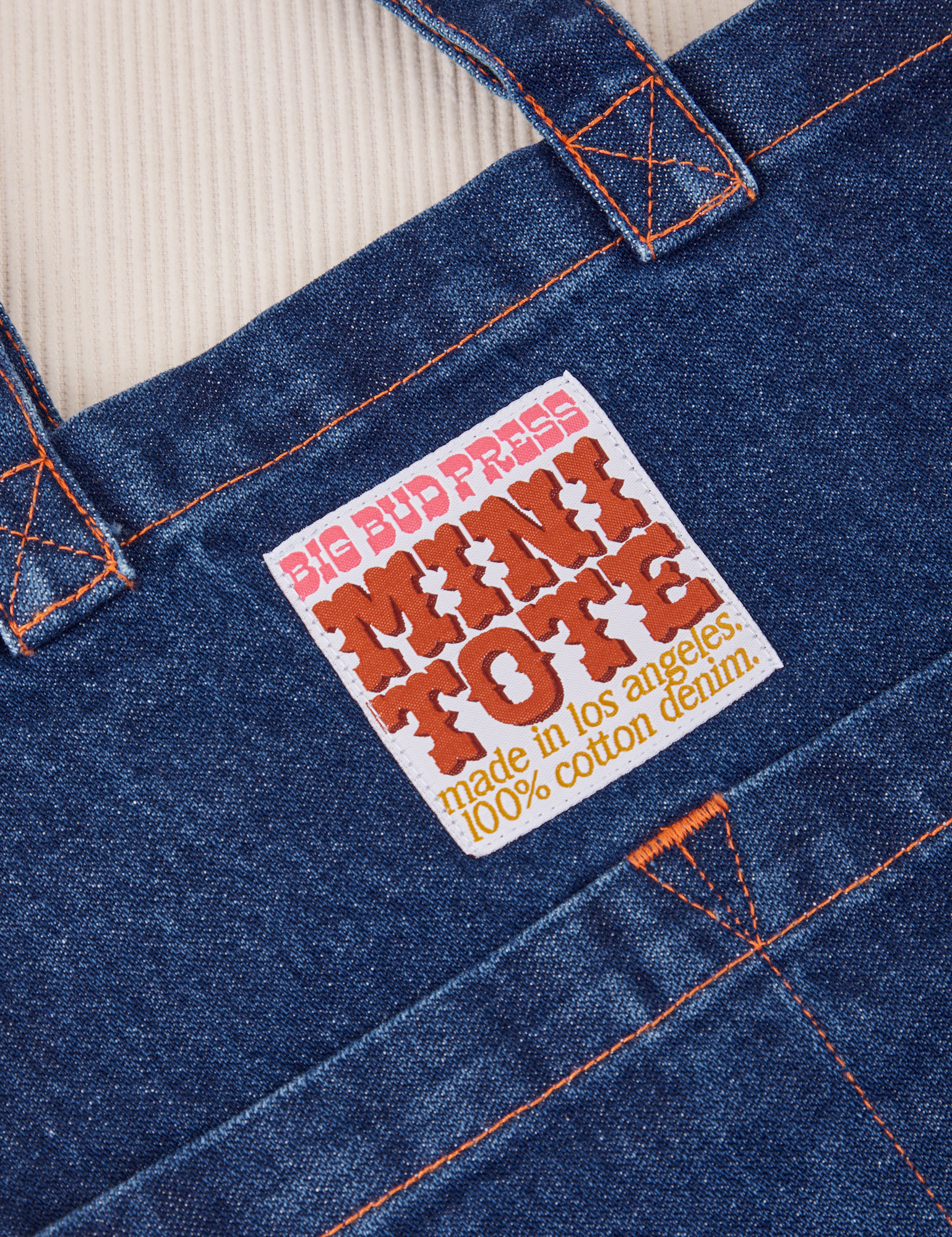 Denim Mini Tote Bag in Dark Wash label close up