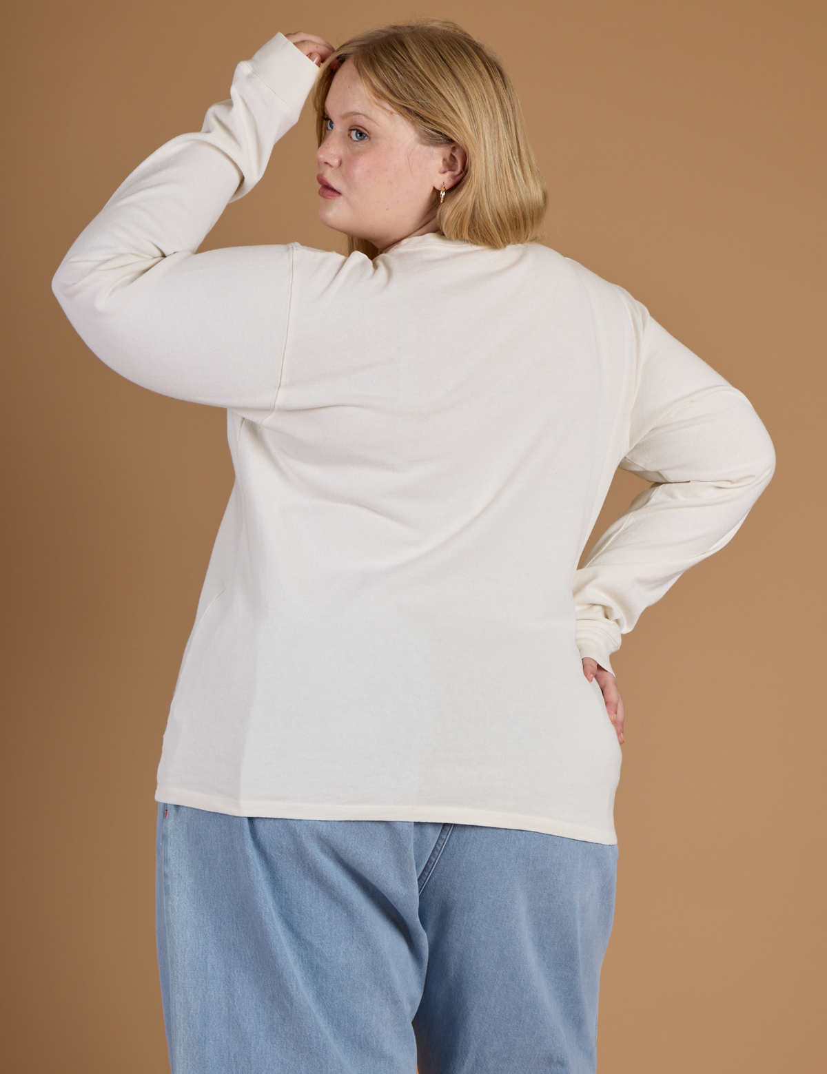 Back view of Juliet wearing the Vintage Tee White Long Sleeve Burly Tee