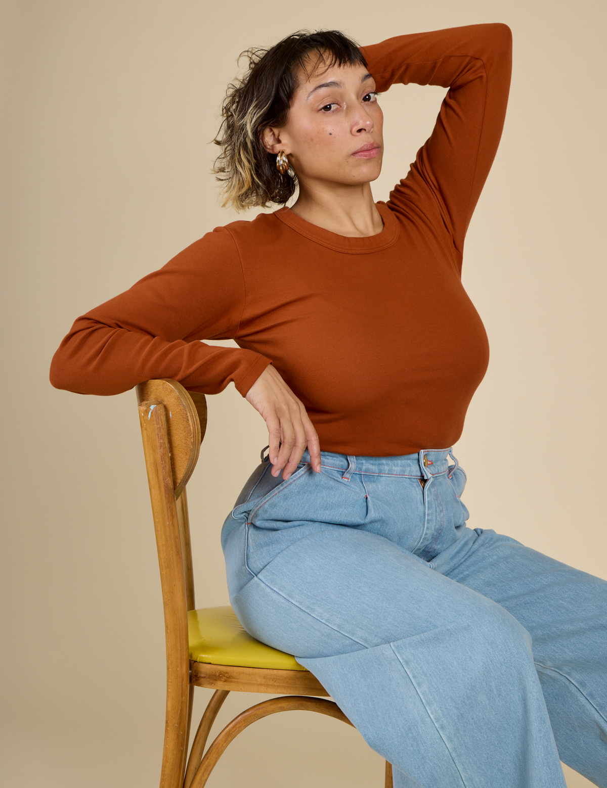 Tiara wearing the Burnt Terracotta Long Sleeve Baby Tee
