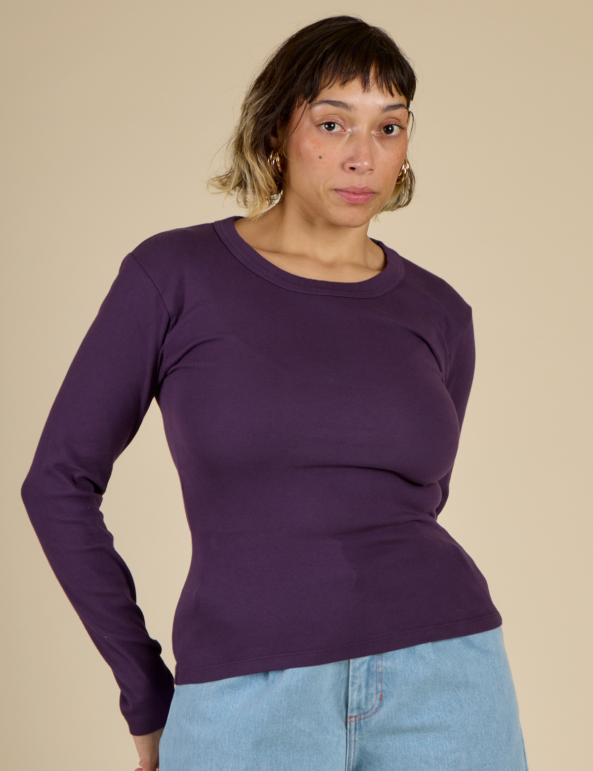 Tiara is 5'4" and wearing XS Nebula Long Sleeve Baby Tee